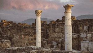 Ancient Roman ruins with columns at sunset