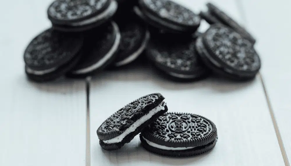 Stack of chocolate sandwich cookies with white cream filling