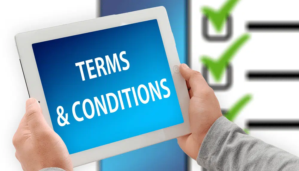 Tablet displaying terms and conditions with checklist