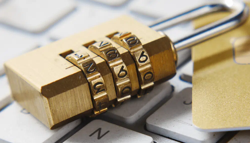 Combination lock on keyboard symbolizing online data security