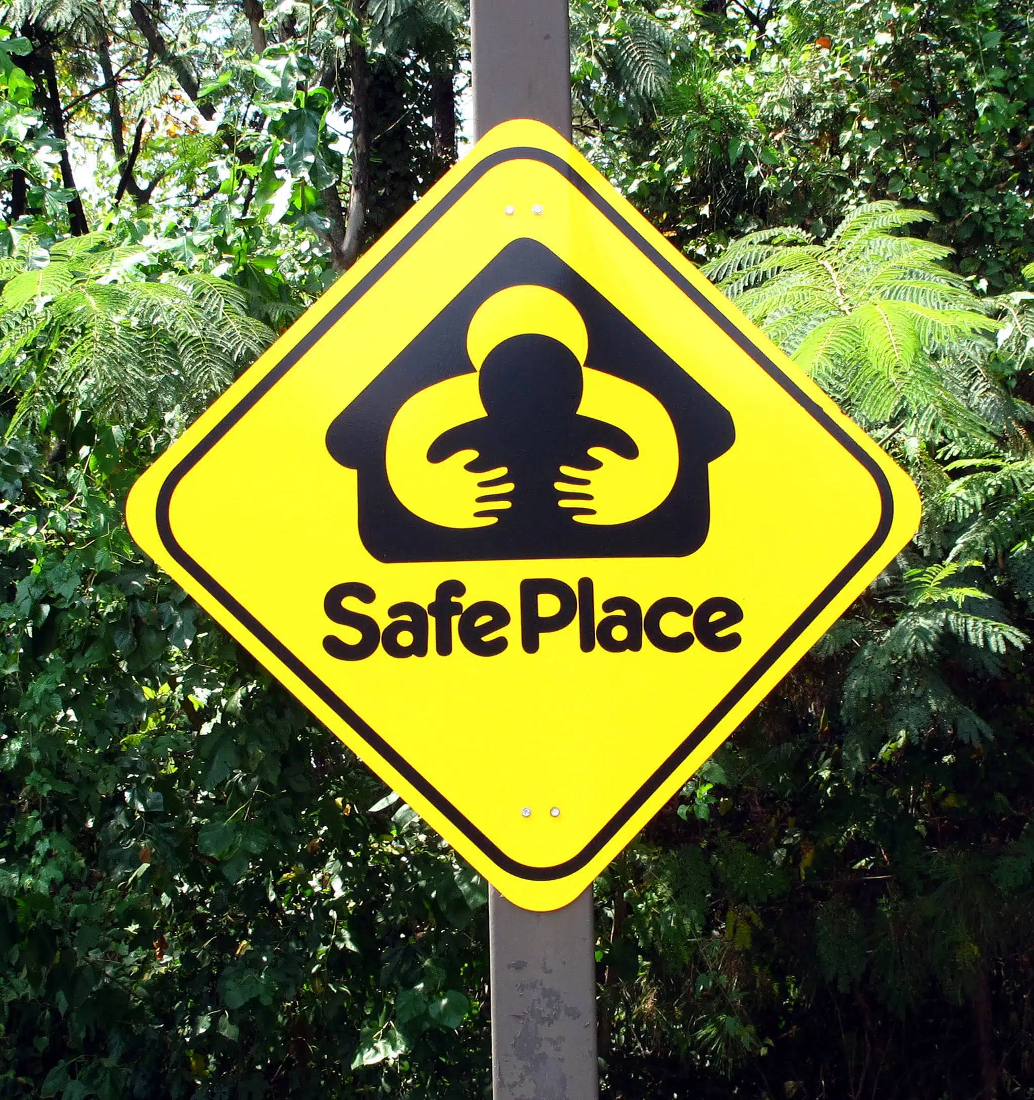 Safe Place sign with black silhouette on yellow background