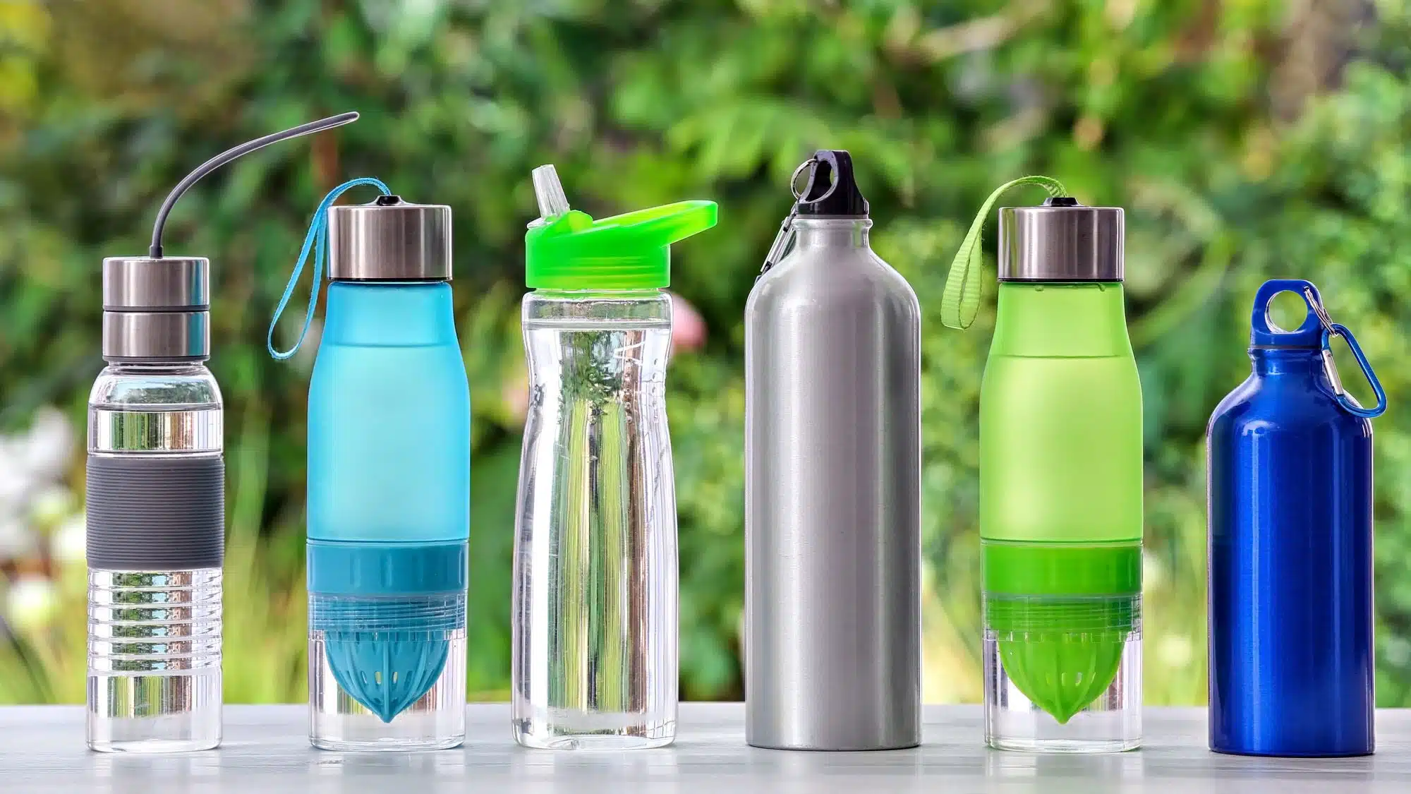Diverse collection of reusable water bottles with various designs and colours