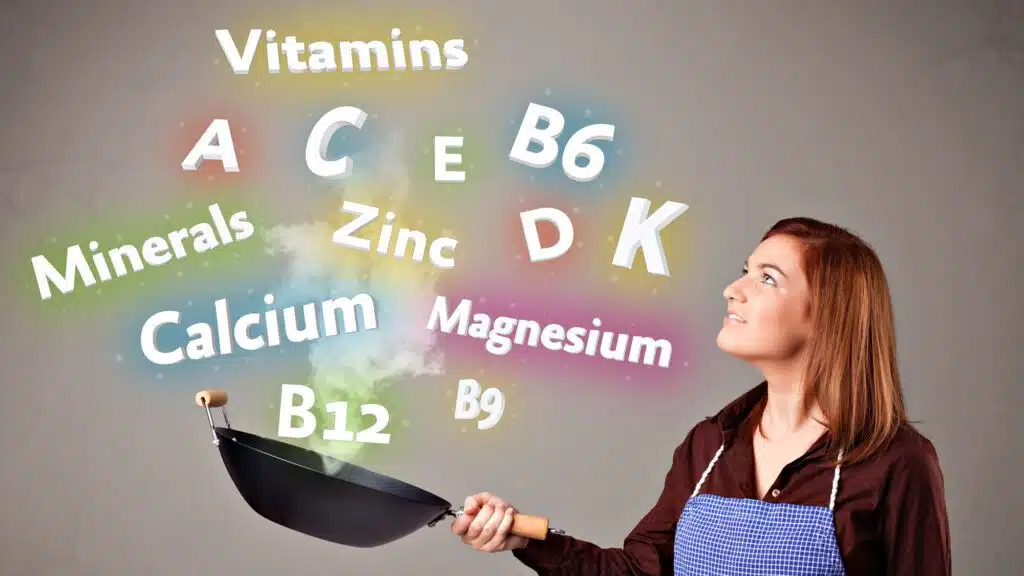 Woman cooking with vitamins and minerals concept with floating words