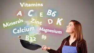 Woman cooking with vitamins and minerals concept with floating words