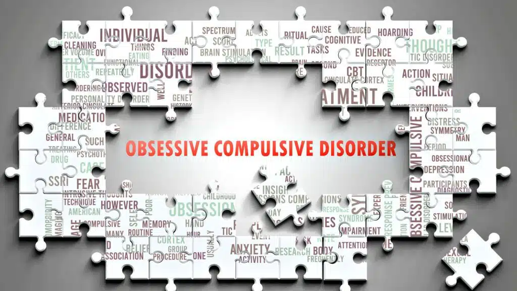 Obsessive Compulsive Disorder text surrounded by mental health keywords on puzzle pieces