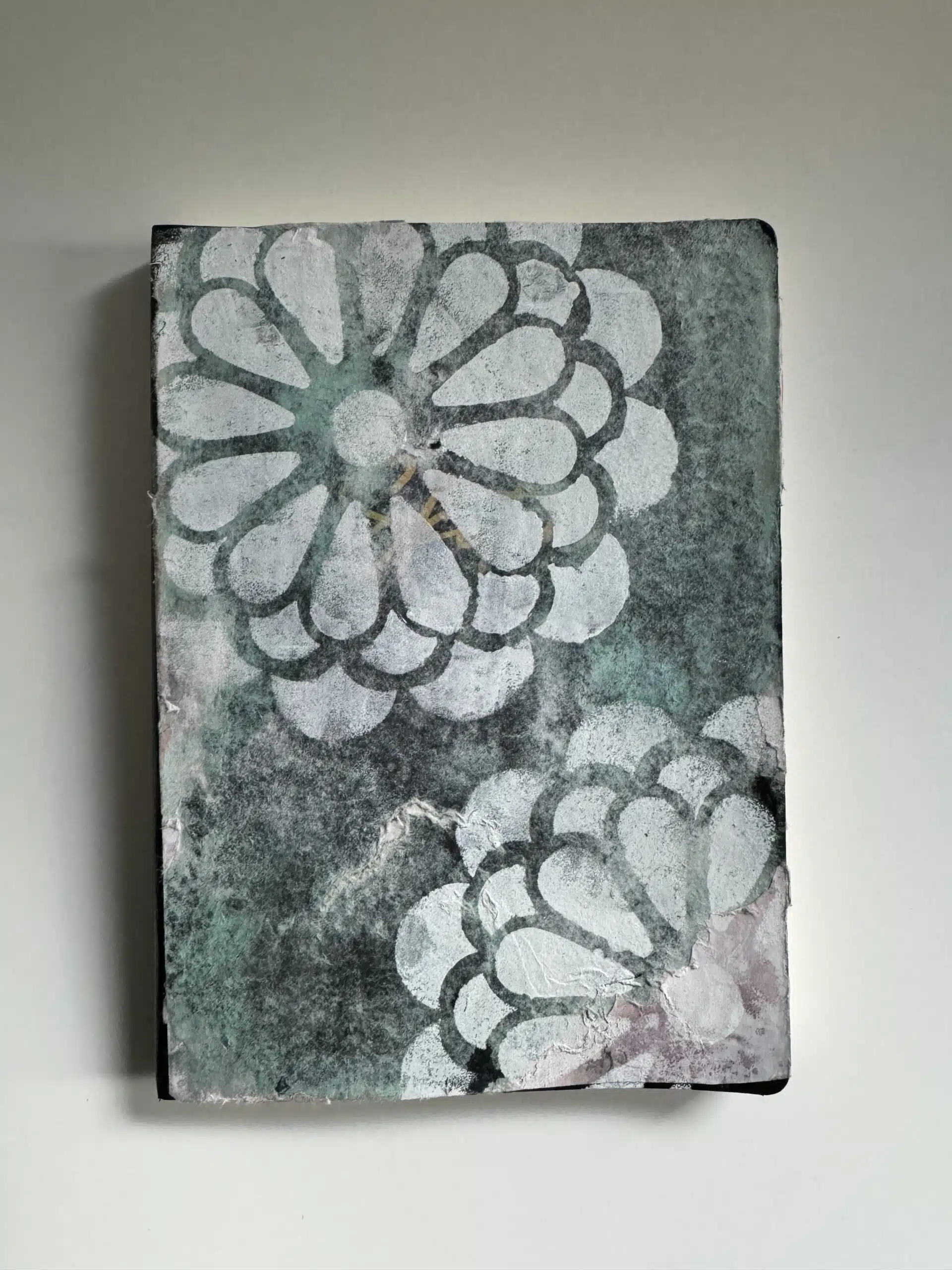 Canvas with abstract floral design in white and grey