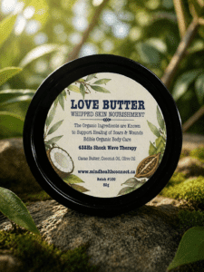 Love Butter whipped skin nourishment container on mossy rocks
