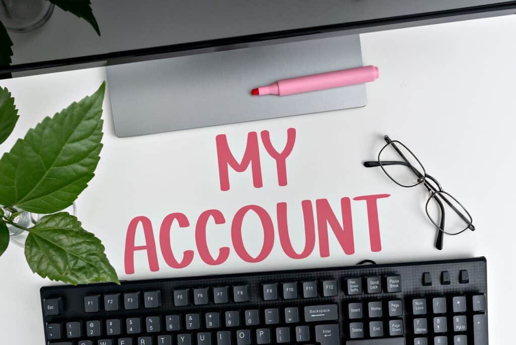 My account concept with keyboard, glasses, plant, and pink highlighter