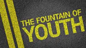 Text 'The Fountain of Youth' on asphalt background
