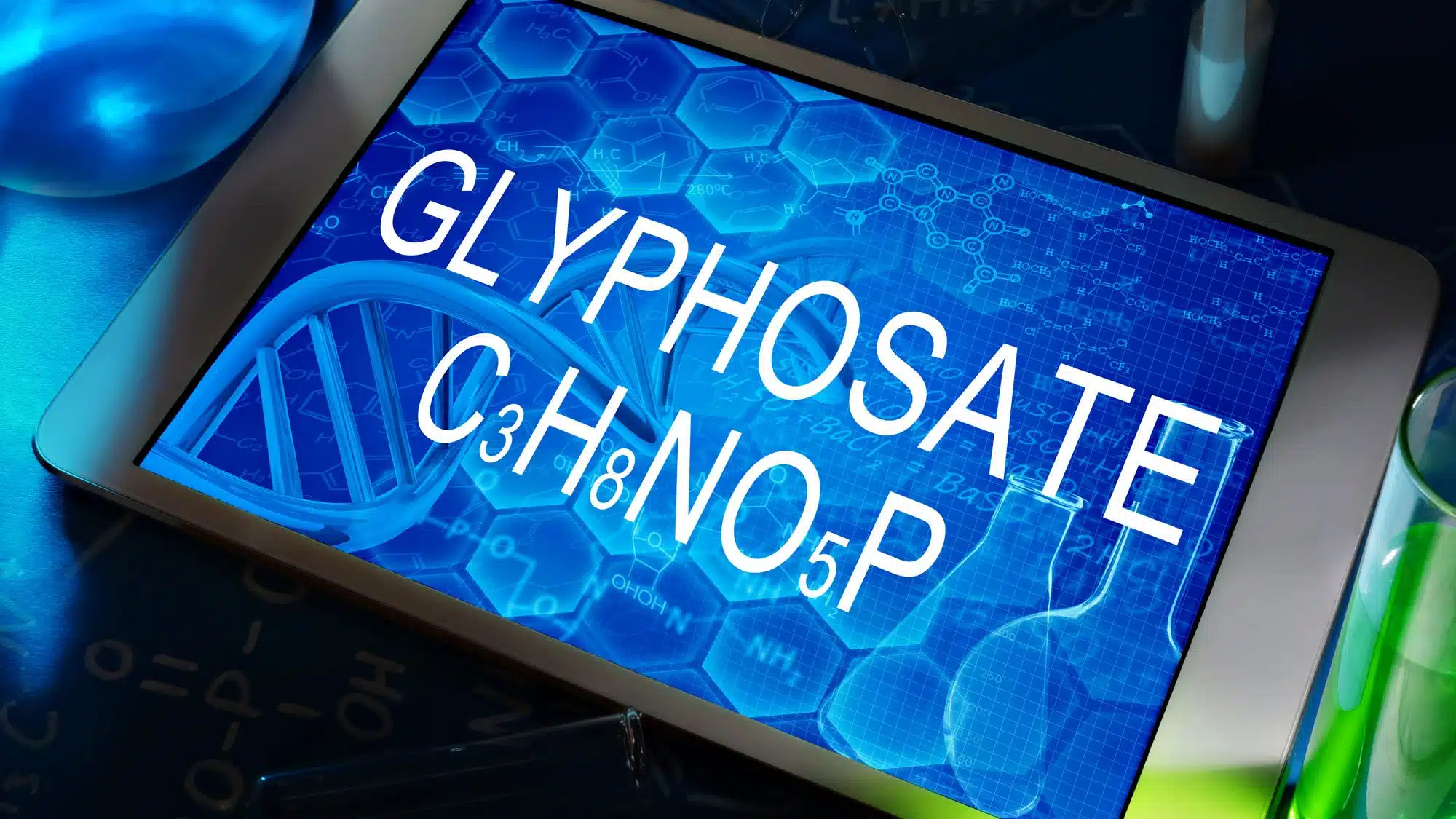 Tablet display showing glyphosate chemical formula C3H8NO5P