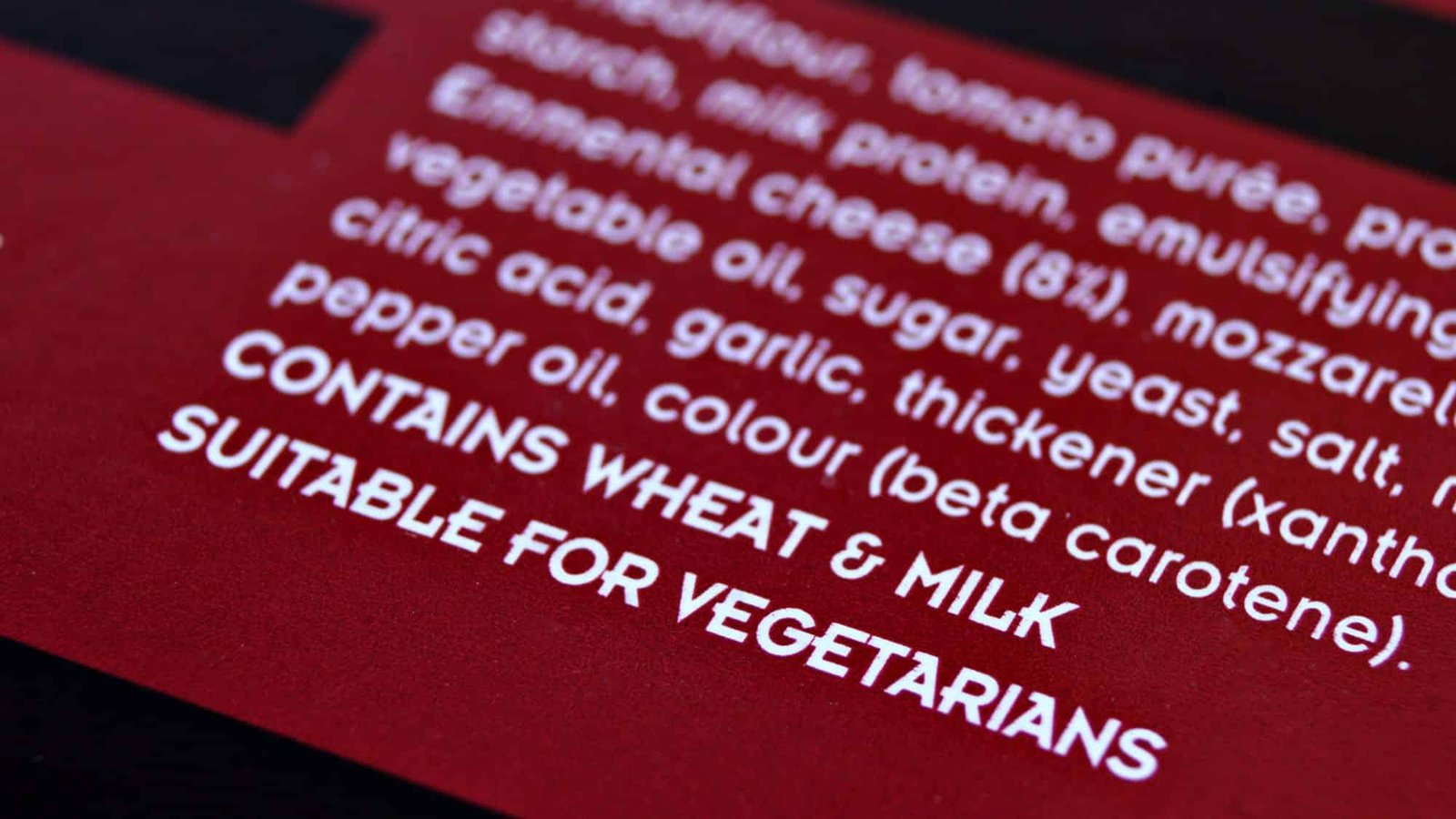 Close-up of food packaging label showing ingredients and dietary suitability