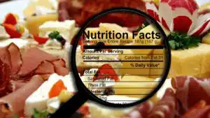 Magnified nutrition facts over assorted cheese and meats platter
