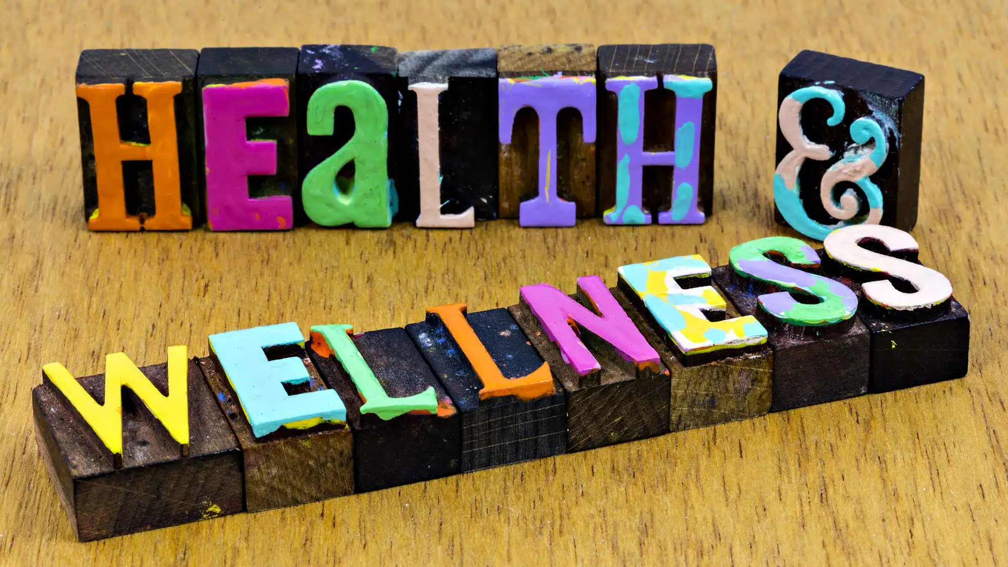 Colourful wooden blocks spelling Health and Wellness