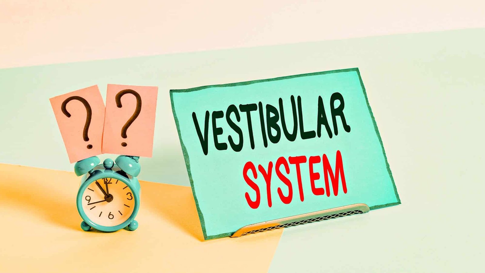 Vestibular system concept with clock and question marks