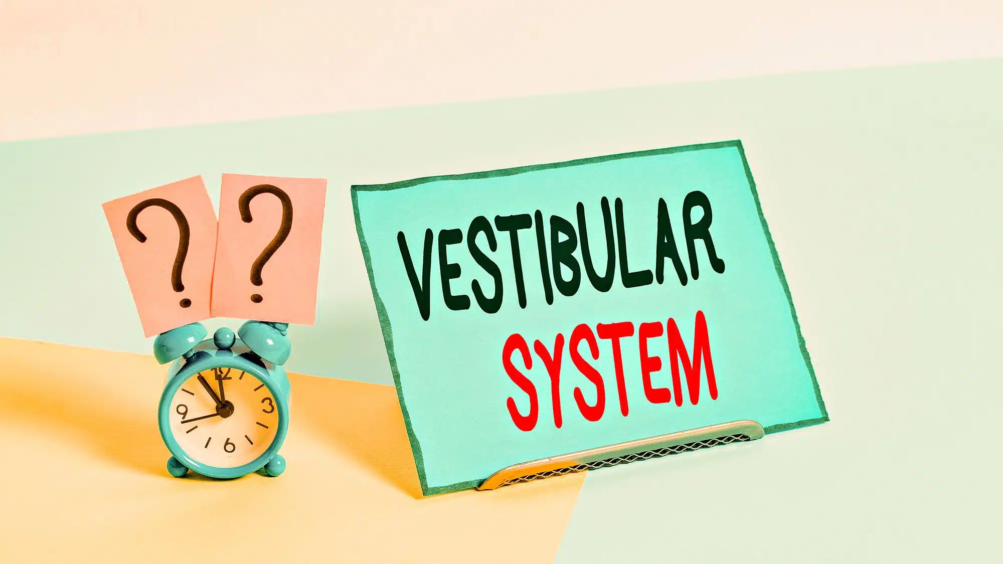 Vestibular system concept with clock and question marks