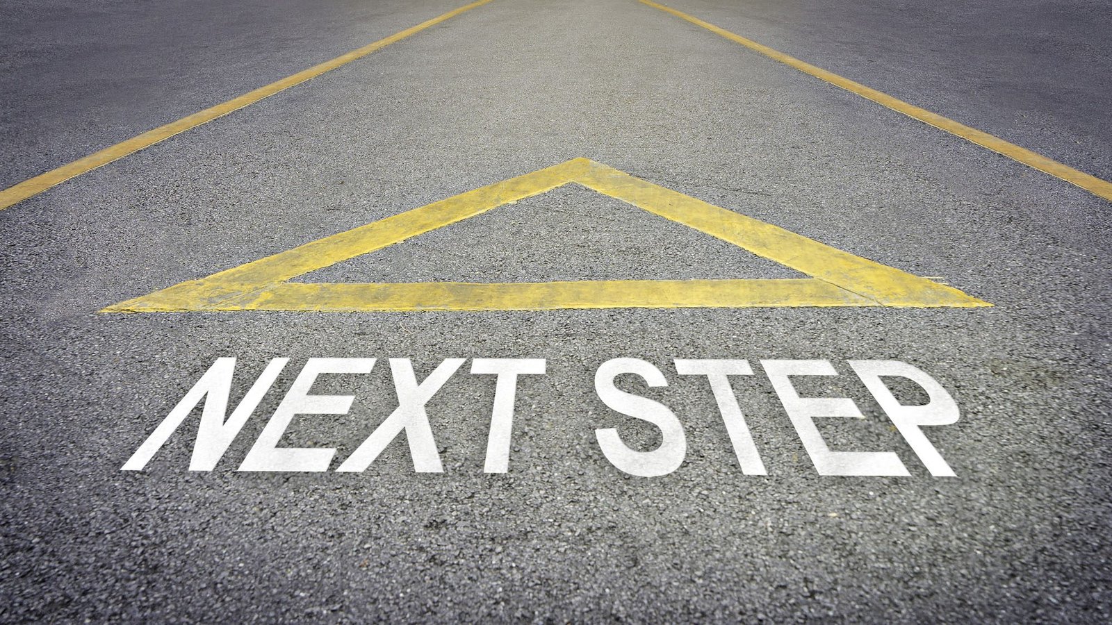 Road with 'NEXT STEP' and triangle, symbolizing progression