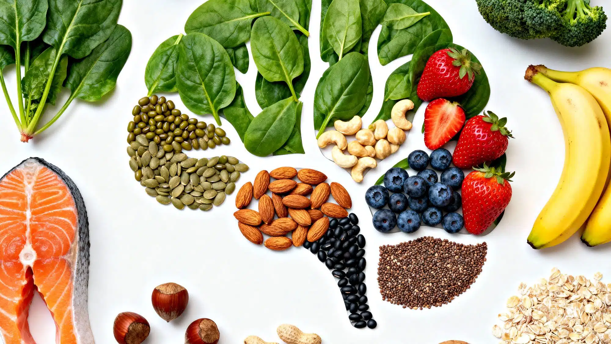 Healthy brain foods including salmon, nuts, berries, and leafy greens