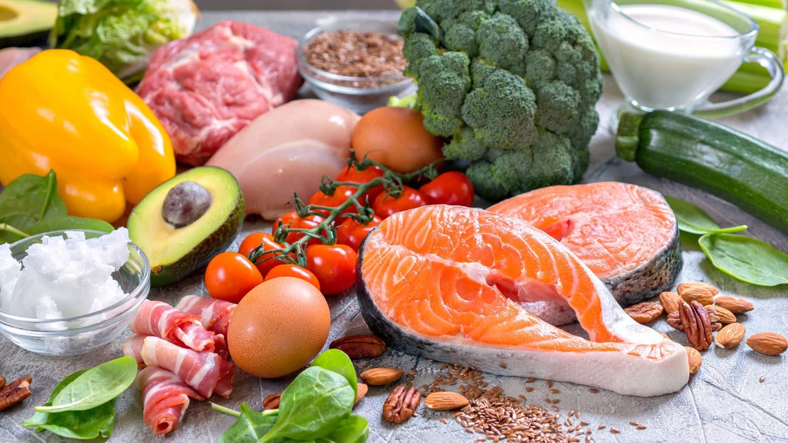 Assorted healthy foods including salmon, vegetables, and nuts